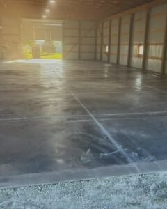Large glossy finished gray concrete floor in a barn in Wilson, NC