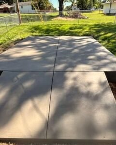 Gray concrete slabs in a fenced backyard in Wilson, NC