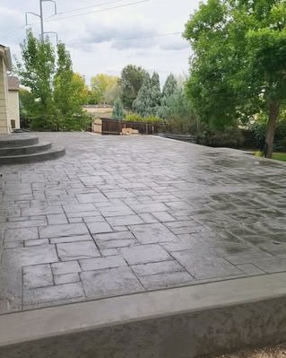 Large gray slate pattern stamped concrete patio in Wilson, NC
