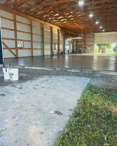 Smooth gray concrete floor inside a pole barn in Wilson, NC